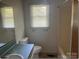 Functional bathroom with a shower/tub and window for natural light at 1327 Crestview Dr, Shelby, NC 28150