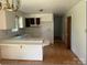 Functional kitchen space with ample cabinets, countertops, and an eat-in breakfast bar at 1327 Crestview Dr, Shelby, NC 28150