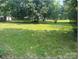 Spacious, grassy lot surrounded by mature trees, offering a serene outdoor setting at 1327 Crestview Dr, Shelby, NC 28150