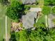 Stunning aerial view of a brick home with lush landscaping, a gazebo, and a pristine lawn at 13358 Bally Bunnion Way, Davidson, NC 28036