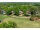 An aerial view showcases the home's proximity to the golf course at 13358 Bally Bunnion Way, Davidson, NC 28036