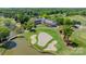 A beautiful aerial view highlights the course's water features, sand traps and clubhouse at 13358 Bally Bunnion Way, Davidson, NC 28036