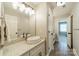 Sleek bathroom with quartz countertops, a vessel sink, modern fixtures, and wood-look flooring at 13358 Bally Bunnion Way, Davidson, NC 28036