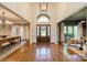 Elegant foyer with hardwood floors, high ceilings, and a view into the dining and living rooms at 13358 Bally Bunnion Way, Davidson, NC 28036