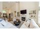 Bright living room featuring a cozy fireplace, built-in shelving, and an open concept layout at 13358 Bally Bunnion Way, Davidson, NC 28036