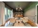 Bright office space with hardwood floors, large window, stylish lighting, and neutral decor at 13358 Bally Bunnion Way, Davidson, NC 28036