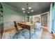 Comfortable office features natural lighting, stylish decor, and hardwood flooring at 13358 Bally Bunnion Way, Davidson, NC 28036