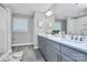 Elegant bathroom with double vanity, granite countertops, and modern lighting at 1412 W 4Th St, Charlotte, NC 28208