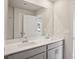 Bathroom featuring double sinks, a large mirror, and modern fixtures at 150 Aberdeen Dr, Salisbury, NC 28144