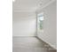 Bright, empty bedroom with a window that offers natural light and neutral carpeting at 150 Aberdeen Dr, Salisbury, NC 28144