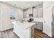 Modern kitchen with stainless steel appliances, white cabinets, and an island with quartz countertops at 150 Aberdeen Dr, Salisbury, NC 28144