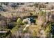 Aerial view of a home surrounded by trees and greenery, showcasing the property's serene setting at 150 Hidden Oak Dr, Statesville, NC 28677