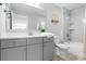 Modern bathroom features a vanity, decorative mirror and tiled shower over tub at 152 Broadleaf Dr, Denver, NC 28037