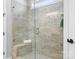 Modern bathroom features a tiled shower with glass door, seating and modern fixtures at 152 Broadleaf Dr, Denver, NC 28037