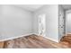 A bedroom with hardwood floors leading to an attached bathroom at 152 Broadleaf Dr, Denver, NC 28037