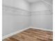 Empty walk-in closet with hardwood floor and wire shelving at 152 Broadleaf Dr, Denver, NC 28037