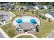 Aerial view of the community clubhouse with swimming pool, lounge chairs, and umbrellas at 152 Broadleaf Dr, Denver, NC 28037
