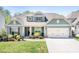 Charming home with a two-car garage, complemented by a well-manicured lawn and tasteful landscaping at 152 Broadleaf Dr, Denver, NC 28037