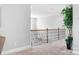 Hallway with neutral carpet, railing, and plant at 152 Broadleaf Dr, Denver, NC 28037