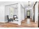 Open-concept living area featuring hardwood floors, stylish furnishings, and abundant natural light at 152 Broadleaf Dr, Denver, NC 28037