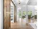 Spacious living room with sliding barn doors and views of the outdoor scenery at 152 Broadleaf Dr, Denver, NC 28037
