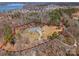 Expansive property with a beautifully landscaped front yard, circular driveway, and ample space for parking at 16455 Harbor View Rd, Charlotte, NC 28278