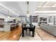 Open-concept dining room with a modern chandelier adjacent to the kitchen and living area at 16455 Harbor View Rd, Charlotte, NC 28278