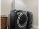 Laundry room featuring front load washer and dryer and upper storage cabinets at 16455 Harbor View Rd, Charlotte, NC 28278