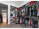 Organized walk-in closet with shelves and hanging space for clothes and shoes at 16455 Harbor View Rd, Charlotte, NC 28278