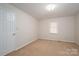 Clean and simple carpeted bedroom with neutral walls and natural light at 1922 Dogwood Flower Ln, Lincolnton, NC 28092
