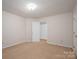 Spacious bedroom with carpeted flooring and a view of the closet at 1922 Dogwood Flower Ln, Lincolnton, NC 28092
