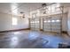 The two car garage with a painted floor offers space for vehicles and projects at 1922 Dogwood Flower Ln, Lincolnton, NC 28092