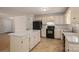 Traditional kitchen with black appliances, tile floors, and a kitchen island at 1922 Dogwood Flower Ln, Lincolnton, NC 28092