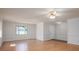 Spacious living room featuring hardwood floors and natural light from windows at 1922 Dogwood Flower Ln, Lincolnton, NC 28092