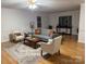 Cozy living room with comfortable seating and a view of the outdoor scenery at 1922 Dogwood Flower Ln, Lincolnton, NC 28092