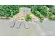 Aerial view of the lake community showcasing boat slips, parking area, and surrounding trees at 23128 Goose Down Ln, Lancaster, SC 29720
