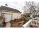 Cozy backyard with brick path, a small garden, and white fence at 23128 Goose Down Ln, Lancaster, SC 29720