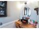 Chic powder room featuring a unique wood countertop and vessel sink at 23128 Goose Down Ln, Lancaster, SC 29720