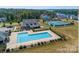 An aerial view showcases a pool and tennis courts, highlighting the community's recreational amenities at 23128 Goose Down Ln, Lancaster, SC 29720