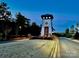 Entrance tower with classic architecture and festive decorations leading to the community at 23128 Goose Down Ln, Lancaster, SC 29720