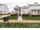 Charming cottage-style home with a welcoming front porch and well-manicured lawn at 23128 Goose Down Ln, Lancaster, SC 29720