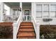 Inviting entrance featuring brick steps leading to a cozy, covered front porch at 23128 Goose Down Ln, Lancaster, SC 29720