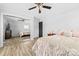 Cozy bedroom features wood-look flooring, mirrored closet, and neutral decor at 2318 Knight Dr, Gastonia, NC 28052