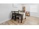 Cozy dining area with a table set for four, bright natural light, and a decorative shelving unit at 2318 Knight Dr, Gastonia, NC 28052