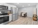 Modern kitchen featuring stainless steel appliances, ample counter space, and an adjacent dining area at 2318 Knight Dr, Gastonia, NC 28052