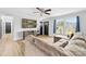 Bright living room with large sectional sofa, modern TV, and natural light from a large window at 2318 Knight Dr, Gastonia, NC 28052