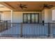 Covered outdoor living space features fireplace and ceiling fan at 2321 Ivey Church Rd, Maiden, NC 28650