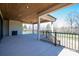 Large covered outdoor living space features fireplace and ceiling fan at 2321 Ivey Church Rd, Maiden, NC 28650