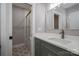 Stylishly decorated bathroom showcasing an updated vanity, mirror and tiled shower with glass doors at 2321 Ivey Church Rd, Maiden, NC 28650