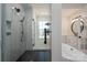 Modern bathroom showcasing a tiled shower with glass enclosure and soaking tub with black fixtures at 2321 Ivey Church Rd, Maiden, NC 28650